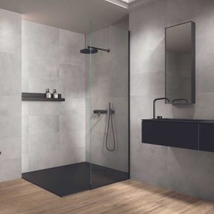 A Bathroom With Motion Light Grey 300x600 Concrete Effect Porcelain Tile on a wall and floor